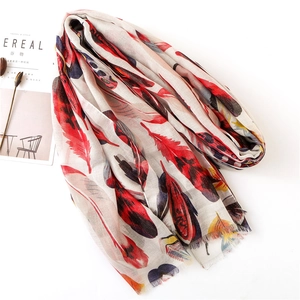 Linen blend scarf with colorful feather prints and frayed edges on white background