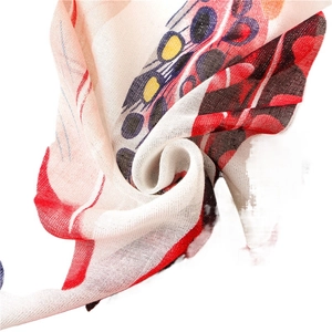 Glittery cotton linen scarf featuring colorful feather prints and soft woven texture