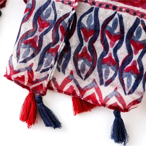 Detailed view of bohemian cotton linen scarf featuring geometric prints and fringe tassels