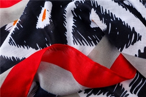 Gros plan du tissu à motifs géométriques noir et rouge avec texture douce respirante