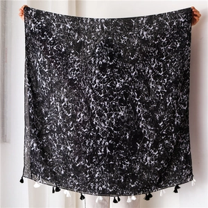 Detail of marble pattern cotton linen scarf with black and white fringe tassels