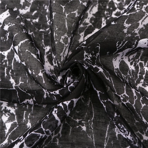 Macro shot of marble print linen scarf showing soft texture and fluid drape detail