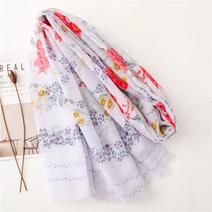 Sciarpa elegante in cotone e lino da donna con stampa floreale e bordi con frange