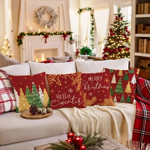 Set of four red Christmas pillow covers with festive tree prints and holiday slogans