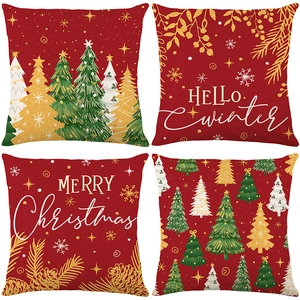 Set of 4 festive red Christmas pillow cases with winter trees and snowflake prints