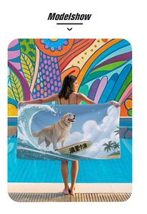Detail of microfiber beach towel featuring a surfing golden retriever and summer palm trees
