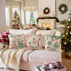 Three Christmas decorative pillow covers with Nutcracker and Merry Christmas patterns on sofa