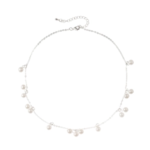 Elegant silver necklace with white pearls and adjustable lobster clasp on white backdrop