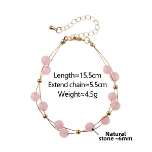 Detailed shot of double-layer pink natural stone bead bracelet with golden chain links