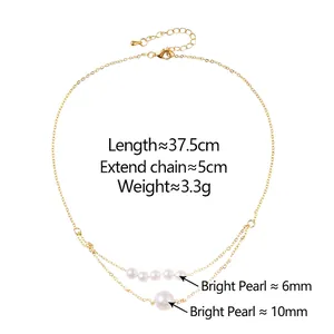 Double-layered gold chain necklace with 6mm and 10mm white pearls on white background