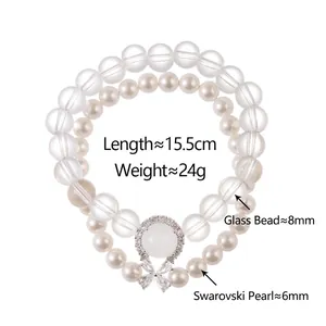 Elegant double-layered bracelet with glass beads, pearls and zircon bow pendant
