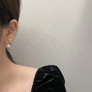 Elegant mermaid pearl stud earrings with gold metal ball for women on model view