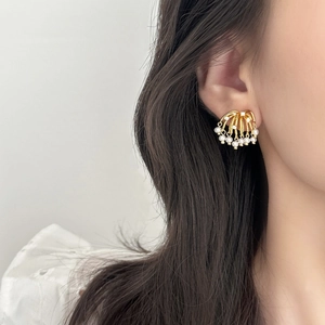 Exaggerated gold firework stud earrings with irregular pearls and sparkling crystals