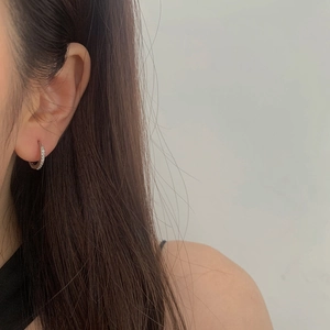 Elegant 18K silver plated micro-pave hoop earrings on model for a minimalist luxury look