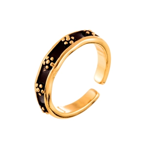 Minimalist adjustable open ring with gold floral accents on black enamel finish