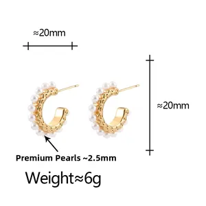 Detailed view of 20mm gold C-shaped hoop earrings with 2.5mm pearls and filigree engraving