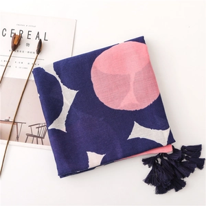 Detail of navy blue cotton linen scarf with pink abstract patterns and premium fringe