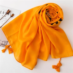 Lightweight orange cotton linen scarf with black polka dots and stylish fringe tassels
