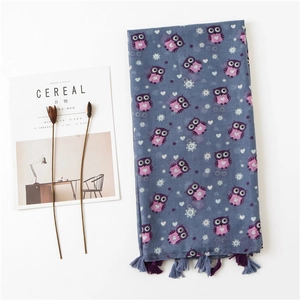 Blue linen cotton scarf with purple owl prints and tassels on white background