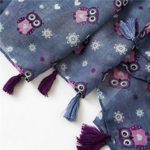 Detailed view of owl print cotton linen scarf with soft purple and blue tassels
