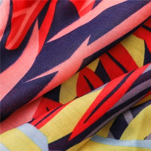 Red and yellow tropical leaf print linen scarf for sun protection and vacation