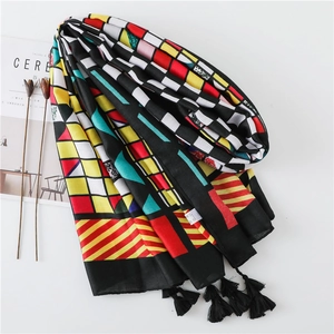 Ethnic style colorful geometric plaid scarf with tassels and artistic aesthetic presentation