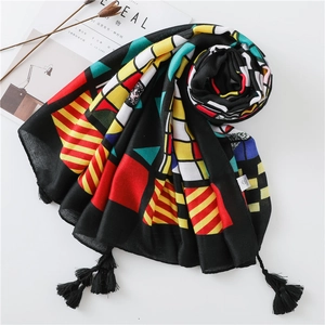 Ethnic vintage colorful geometric scarf with black tassel fringe and vibrant patterns