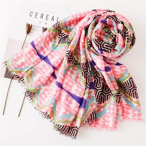 Pink geometric pattern silk scarf with frayed edges for sun protection on white background