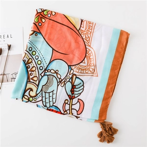 Détail d'une écharpe bohème en coton et lin avec motifs Ganesha et mandala colorés