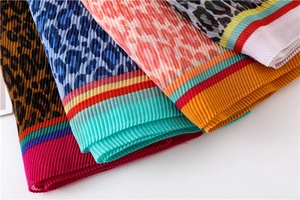 Detailed pleated leopard print scarves in brown, blue, pink and grey with striped edges