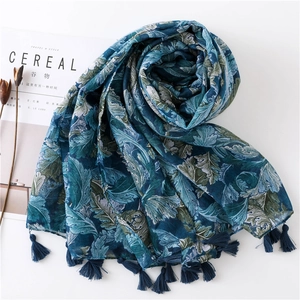 Ethnic paisley print cotton linen shawl scarf with blue fringe on white background