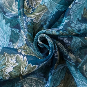 Detailed macro view of lightweight cotton-linen fabric with paisley leaf patterns