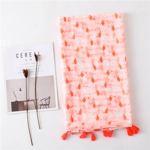 Pink flamingo print linen scarf with orange tassels and lightweight summer texture