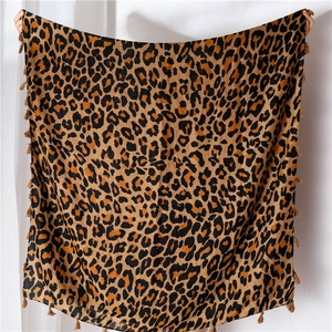 Detailed view of the leopard print cotton linen scarf with fine tassel edge textures