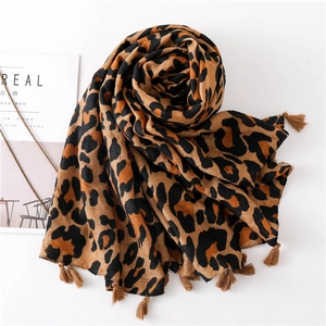Classic leopard print cotton linen scarf with tassel trim on white background