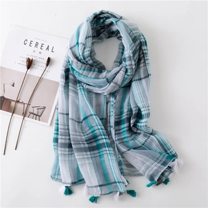 Classic blue and white plaid scarf with fringe tassels for sun protection on the beach