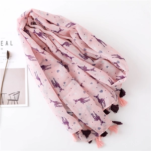 Detail of pink scarf showing colorful deer print and stylish dual-tone tassel fringe edges