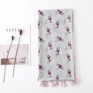 Detail of light grey scarf with purple deer print and pink fringed tassel edges