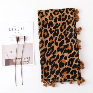 Classic leopard print cotton linen scarf with tassels displayed on a white background