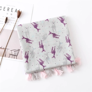 Detail of colorful deer print scarf with soft pink and grey handmade tassels