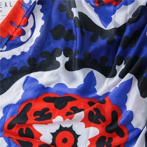 Close-up of bohemian blue leopard pattern scarf fabric with smooth tassel details