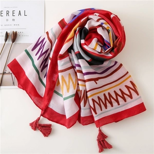 Ethnic geometric pattern beach shawl with red fringe tassels and soft cotton-linen texture