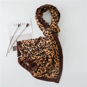 Detailed view of leopard print cotton linen scarf with thick black borders and double-sided texture