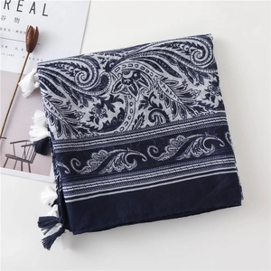 Close-up of navy blue paisley cotton linen scarf with elegant fringe and patterns