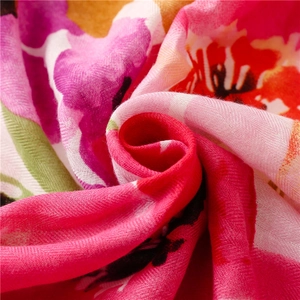 Macro detail of soft cotton-linen fabric with colorful floral print and soft texture