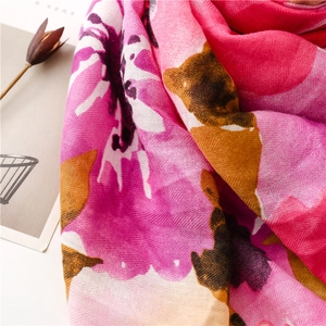 Macro detail of the floral print and herringbone weaving on the soft beach shawl