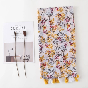 Floral cotton linen scarf with tassels featuring yellow and red flower prints