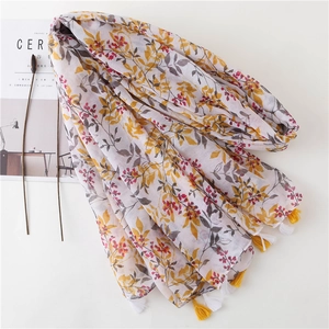 Lightweight cotton linen floral scarf with yellow leaf patterns and tassel edges