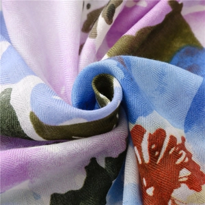 Close-up of lightweight tie-dye linen scarf showing intricate weave and vibrant colors