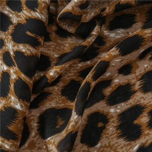 Close-up of leopard print cotton linen shawl showing fine fabric texture and pattern